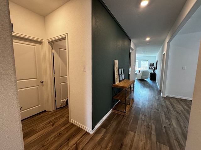 corridor featuring dark wood-type flooring