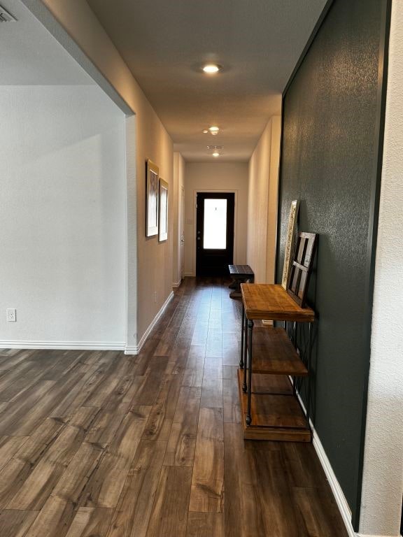 hall with dark wood-type flooring