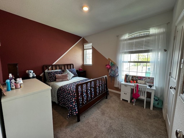 carpeted bedroom with multiple windows