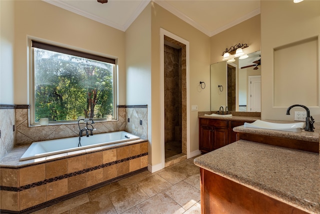 bathroom with shower with separate bathtub, ceiling fan, vanity, crown molding, and tile patterned floors