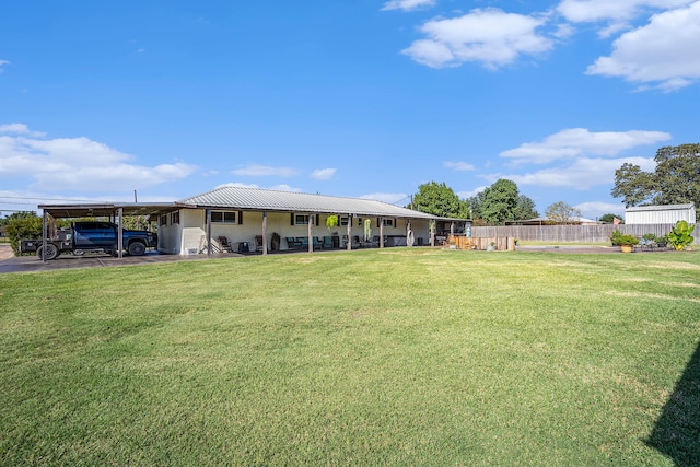 view of yard with a carport