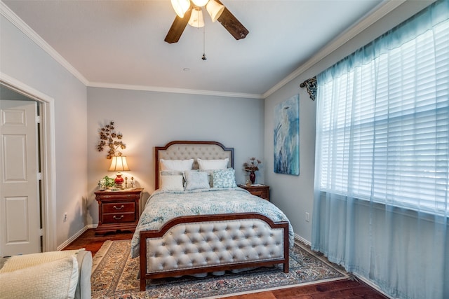 bedroom with dark wood-type flooring, ceiling fan, and ornamental molding