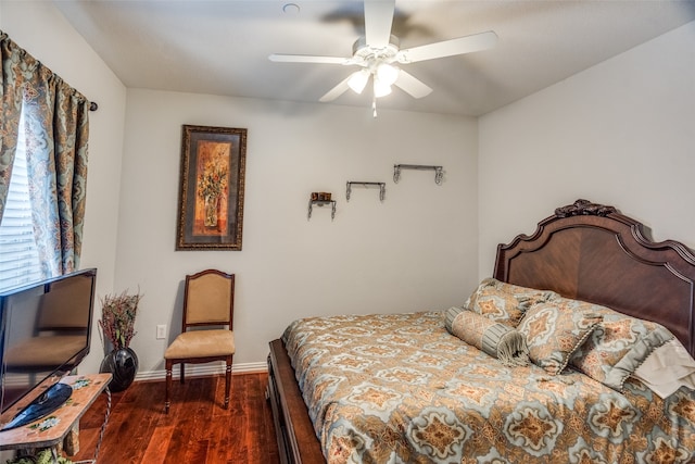 bedroom featuring dark wood-type flooring and ceiling fan