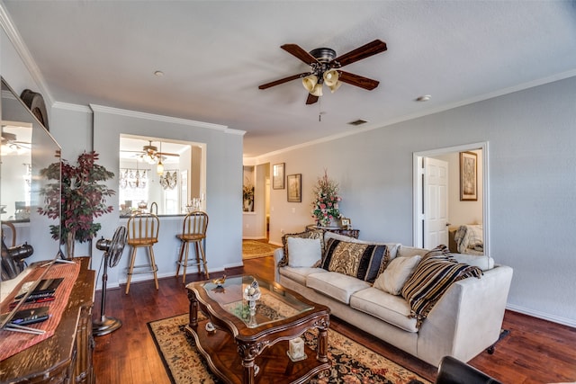 living room featuring ceiling fan, dark hardwood / wood-style flooring, and ornamental molding