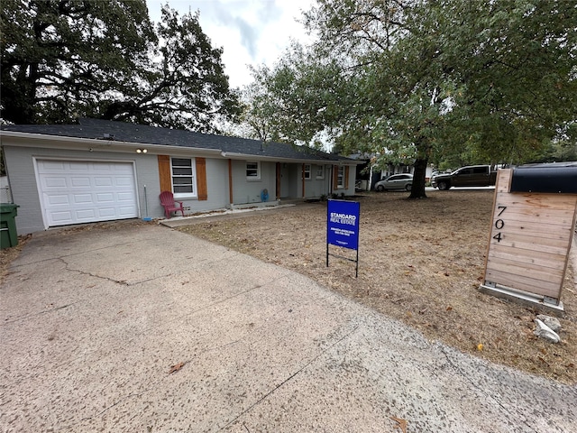 single story home featuring a garage