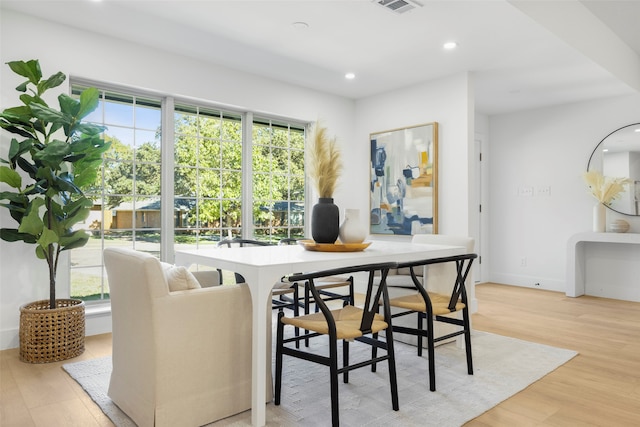 dining space featuring light wood-type flooring