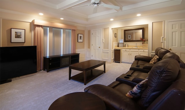 living room with light carpet, crown molding, beamed ceiling, and ceiling fan