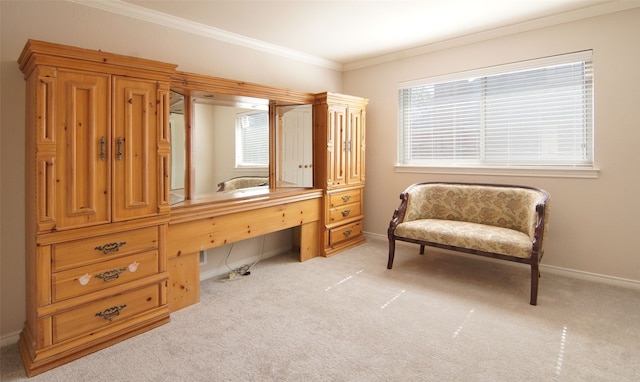 living area with ornamental molding and light colored carpet