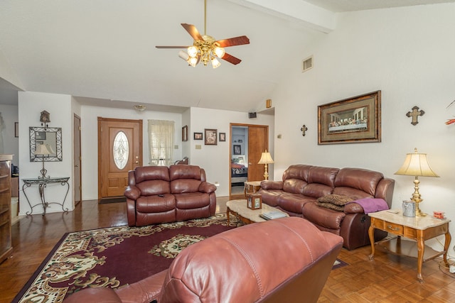 living room with dark parquet floors, vaulted ceiling with beams, and ceiling fan