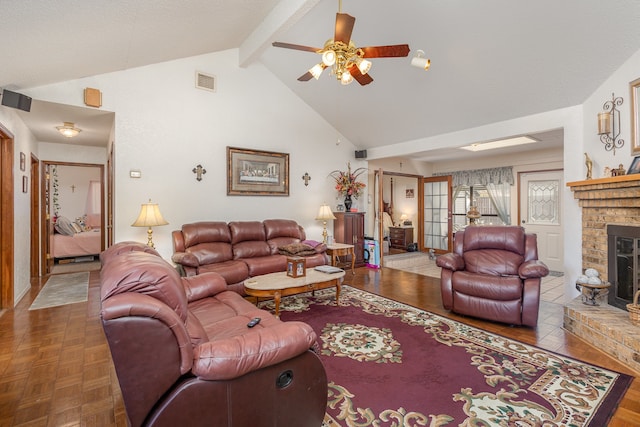 living room featuring parquet flooring, vaulted ceiling with beams, a fireplace, and ceiling fan