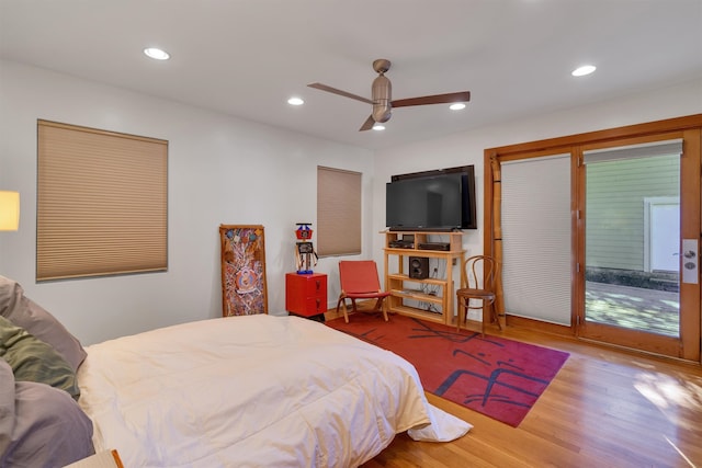 bedroom with ceiling fan, light hardwood / wood-style flooring, and access to exterior