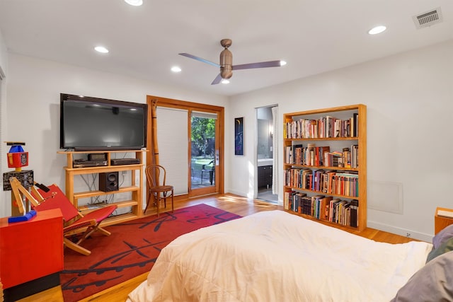 bedroom with light hardwood / wood-style flooring, access to exterior, and ceiling fan