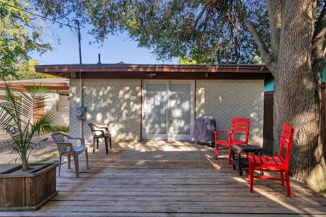 rear view of house with a wooden deck