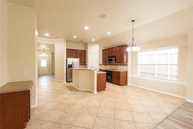 kitchen with backsplash, appliances with stainless steel finishes, pendant lighting, a notable chandelier, and a center island