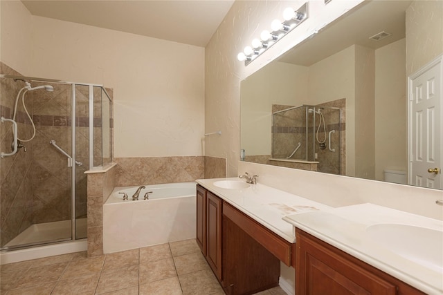 full bathroom with vanity, toilet, shower with separate bathtub, and tile patterned flooring