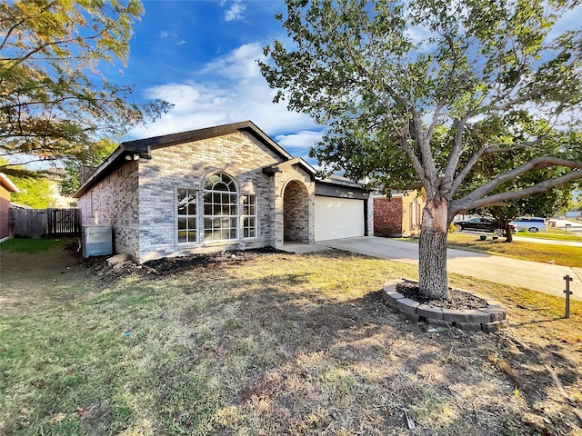 single story home with a front lawn and a garage