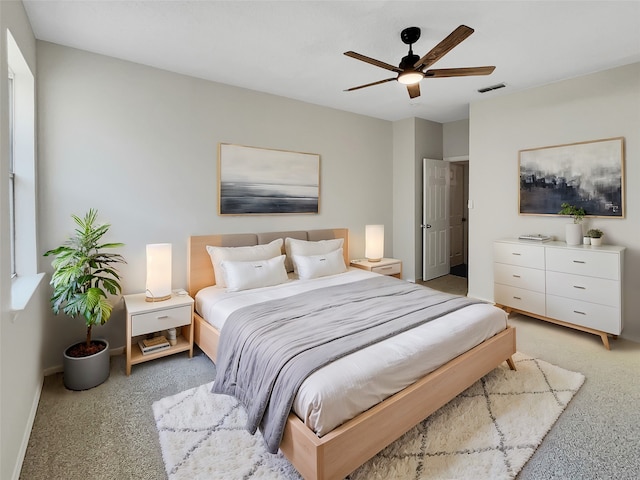 carpeted bedroom with ceiling fan