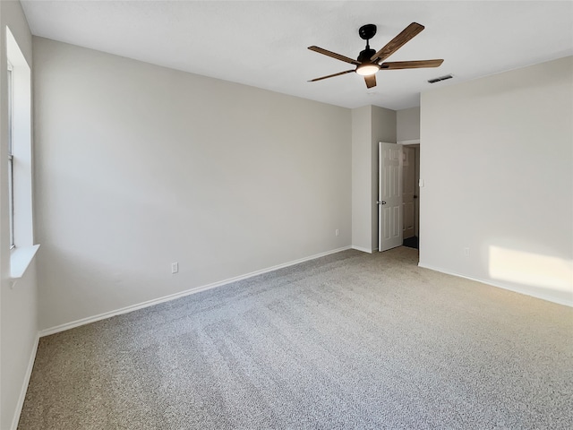 unfurnished room featuring carpet and ceiling fan