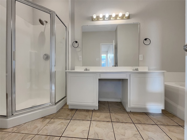 bathroom with vanity and independent shower and bath