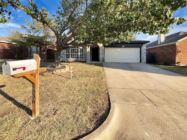 view of property hidden behind natural elements featuring a garage