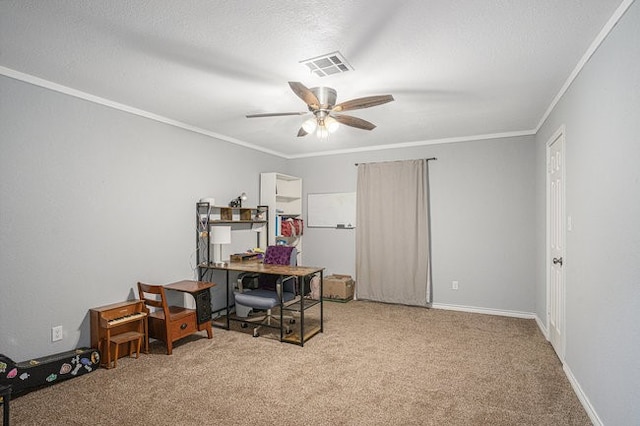 carpeted home office featuring crown molding and ceiling fan