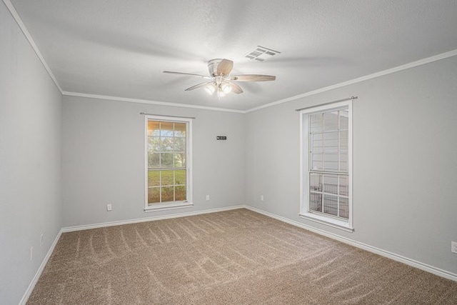 unfurnished room with ceiling fan, crown molding, and carpet floors