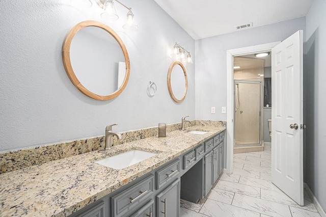 bathroom featuring vanity and an enclosed shower