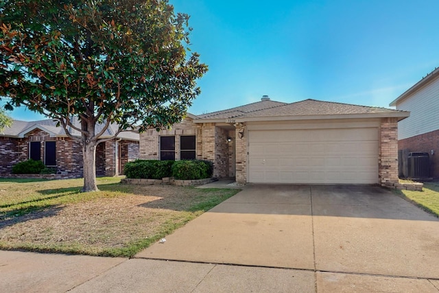 ranch-style house featuring central AC, a garage, and a front yard