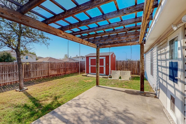 view of yard with a patio area and a storage shed