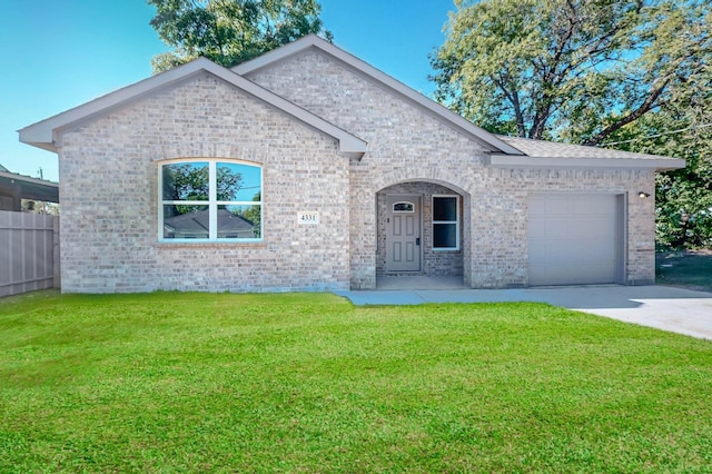 view of front of property with a front yard and a garage