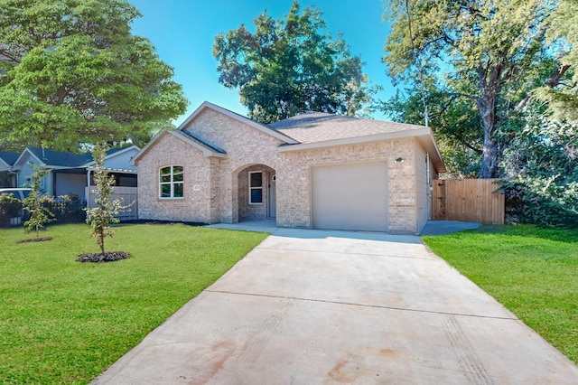 view of front facade with a garage and a front lawn