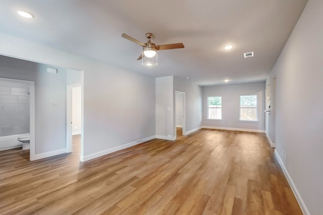 empty room featuring ceiling fan and light wood-type flooring