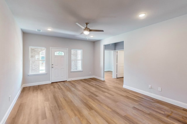 entrance foyer featuring ceiling fan and light wood-type flooring