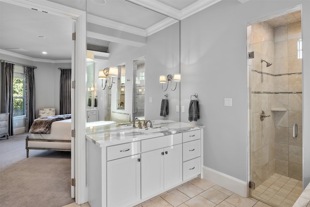 bathroom with vanity, a shower with shower door, ornamental molding, and tile patterned flooring