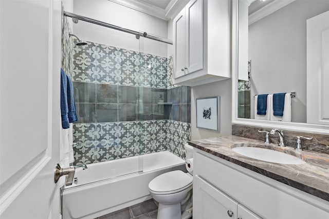 full bathroom featuring shower / bath combination with glass door, toilet, vanity, crown molding, and tile patterned flooring