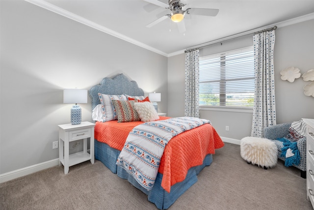 carpeted bedroom featuring ceiling fan and crown molding