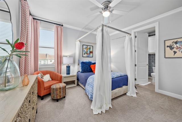 carpeted bedroom featuring ornamental molding, connected bathroom, and ceiling fan