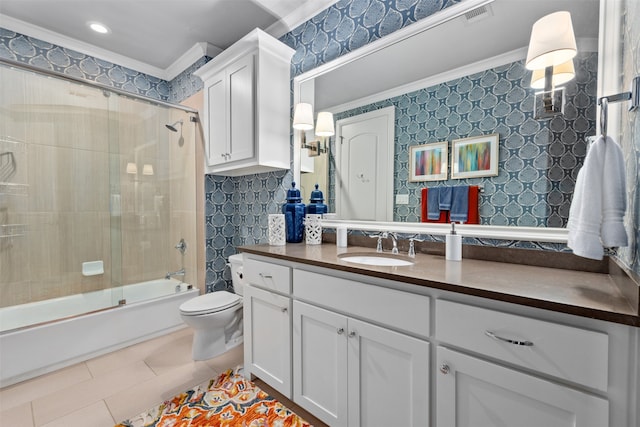 full bathroom featuring toilet, enclosed tub / shower combo, tile patterned floors, vanity, and crown molding