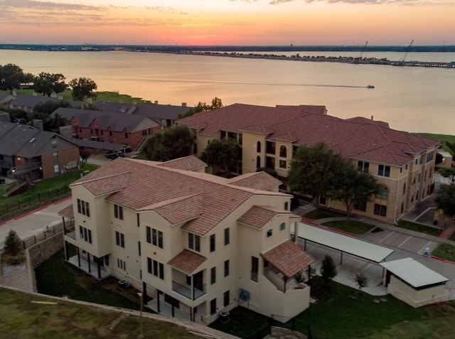 aerial view at dusk with a water view