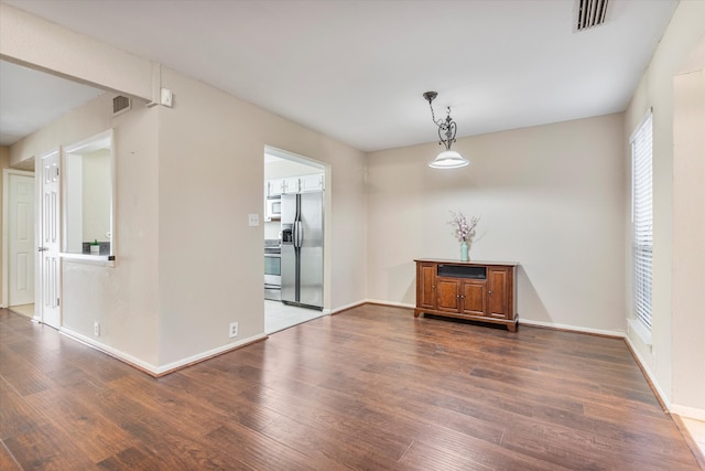 empty room featuring dark hardwood / wood-style floors