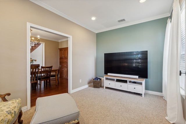 living room with carpet, ornamental molding, and an inviting chandelier