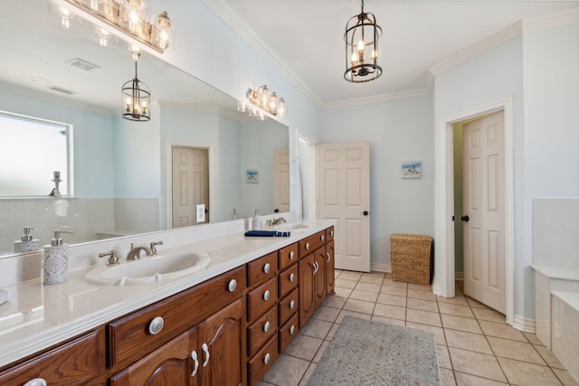 bathroom with vanity, crown molding, and tile patterned flooring