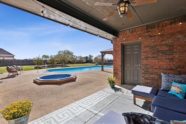 view of swimming pool featuring a patio, an in ground hot tub, and ceiling fan