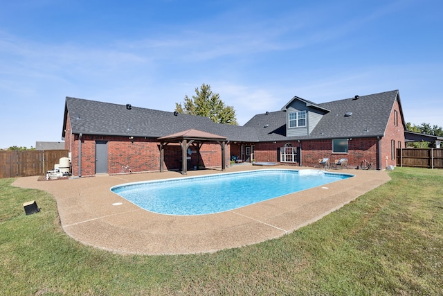 view of pool with a patio, a gazebo, and a lawn