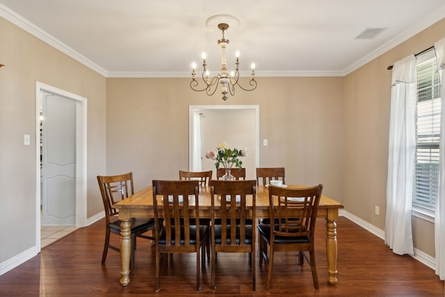 dining room featuring ornamental molding, an inviting chandelier, and dark hardwood / wood-style floors