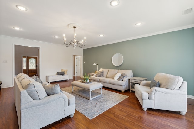 living room with ornamental molding and dark hardwood / wood-style floors