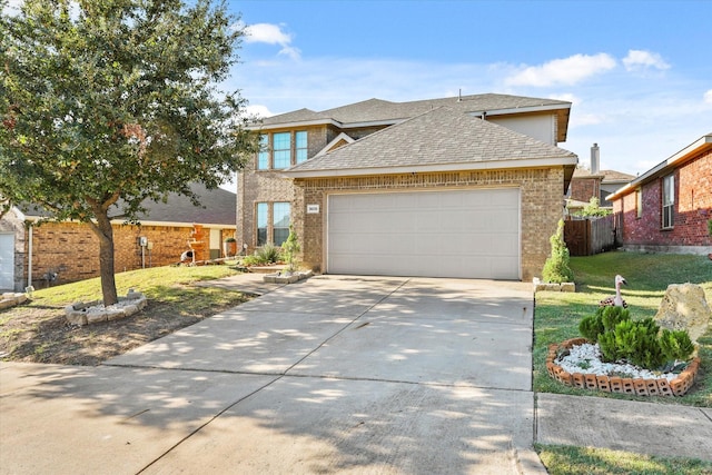 view of front of home featuring a garage and a front lawn