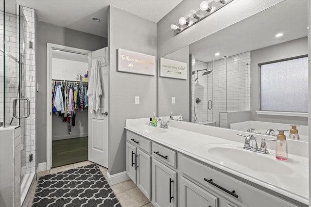 bathroom with vanity, tile patterned floors, and independent shower and bath