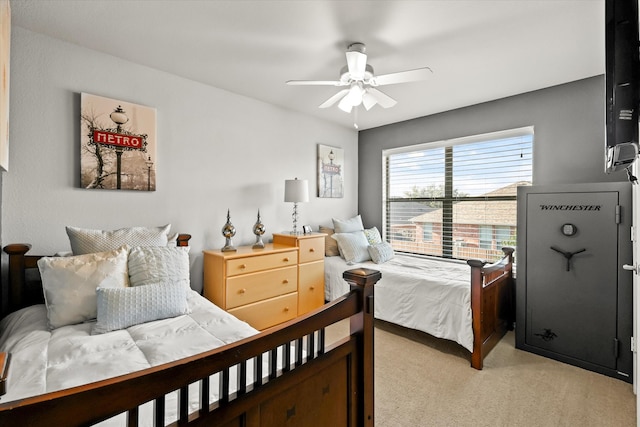 bedroom with light carpet and ceiling fan