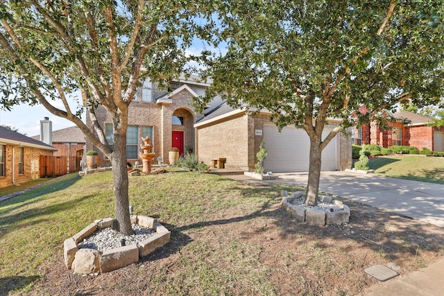 view of front of house featuring a front lawn and a garage